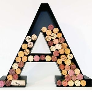 Black metal wall hanging wine cork holder letter A